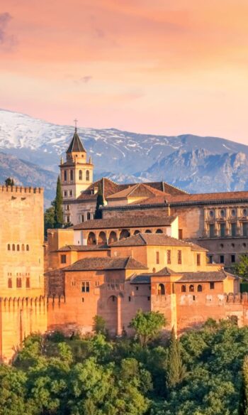 Ancient arabic fortress Alhambra at the beautiful evening time, Granada, Spain, European travel landmark hero